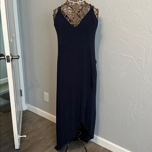 Sweet Lovely size medium dark blue asymmetrical dress. Criss cross back